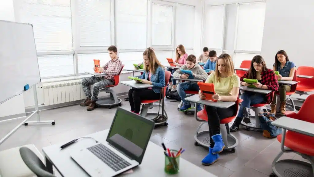 Teacher Using Interactive Whiteboard in a Digital Classroom